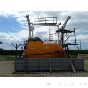 Totally enclosed lifeboat with gravity luffing arm davit